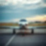 A sleek small aircraft parked at a tranquil airstrip